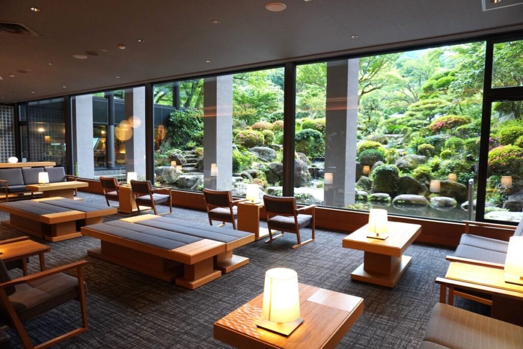 Lounge overlooking the Japanese garden at Yoshiike Ryokan
