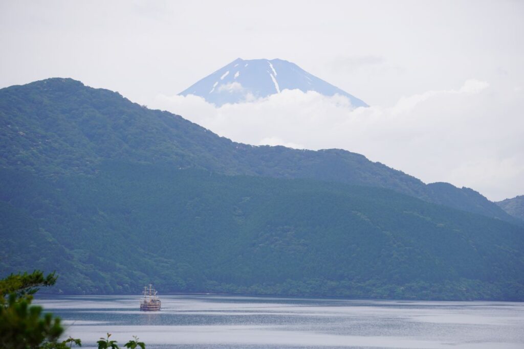 Mt. Fuji above the clouds viewed from Onshi Hakone Park overlooking Lake Ashi