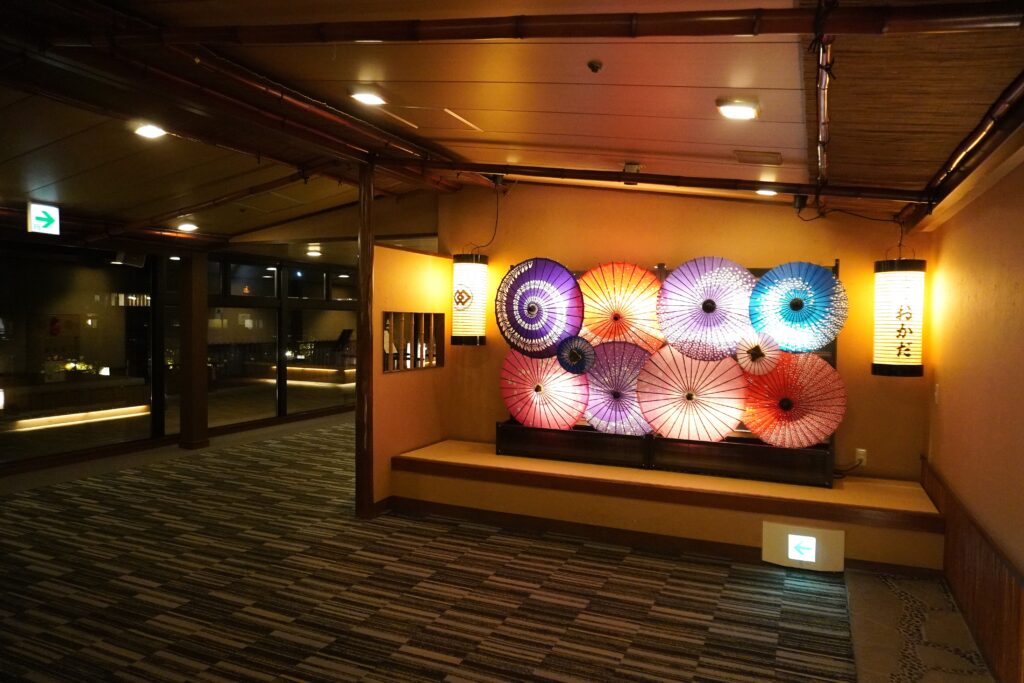 Japanese paper umbrella display in the Hotel Okada onsen corridor in Hakone