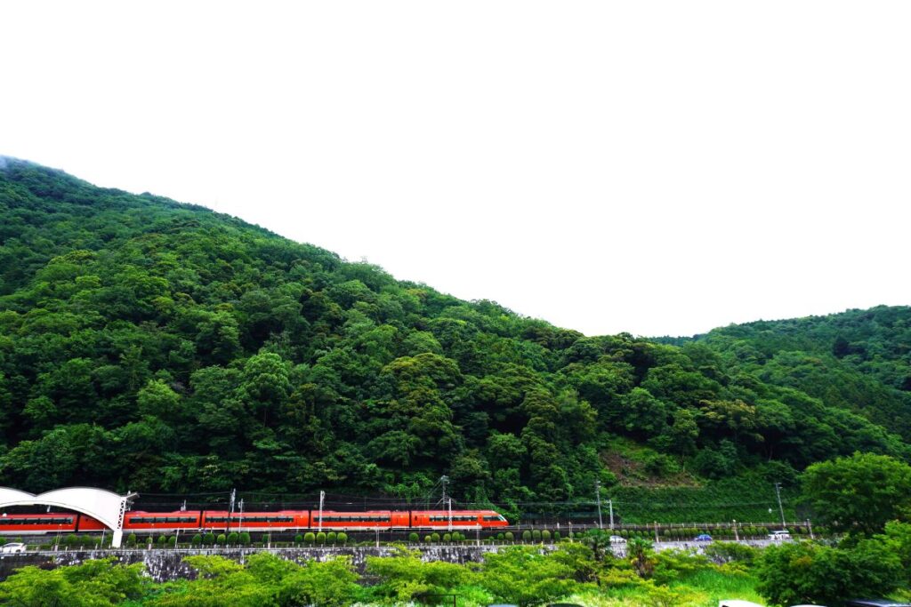 Odakyu Romancecar running through the green mountains of Hakone-Yumoto