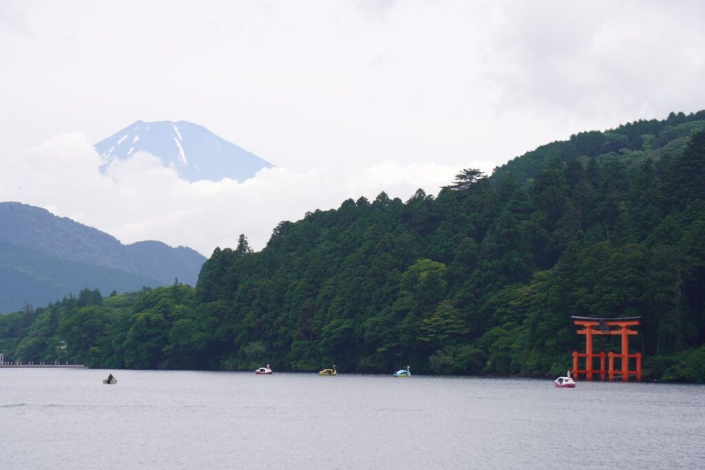 Lake Ashi with Mt. Fuji in the distance and the red torii gate of Hakone Shrine