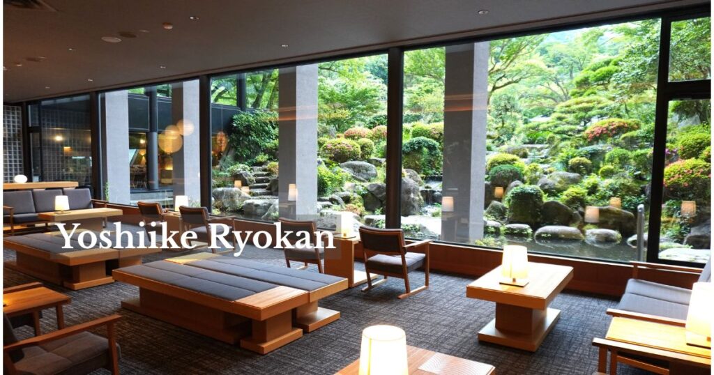 Lobby lounge overlooking the Japanese garden at Yoshiike Ryokan in Hakone-Yumoto
