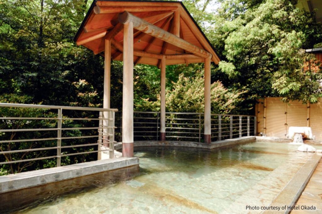 Spacious indoor hot spring bath with large windows at Hotel Okada in Hakone (Photo courtesy of Hotel Okada)