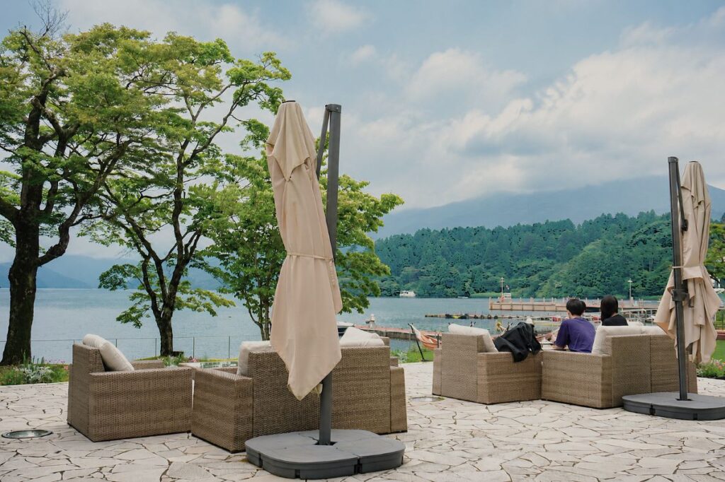 Outdoor terrace lounge with Lake Ashi views at Hakone Hotel