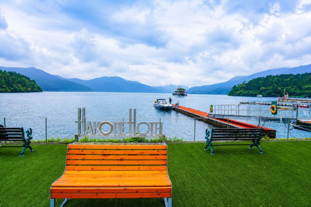 Lakefront lawn and pier at Hakone Hotel on Lake Ashi