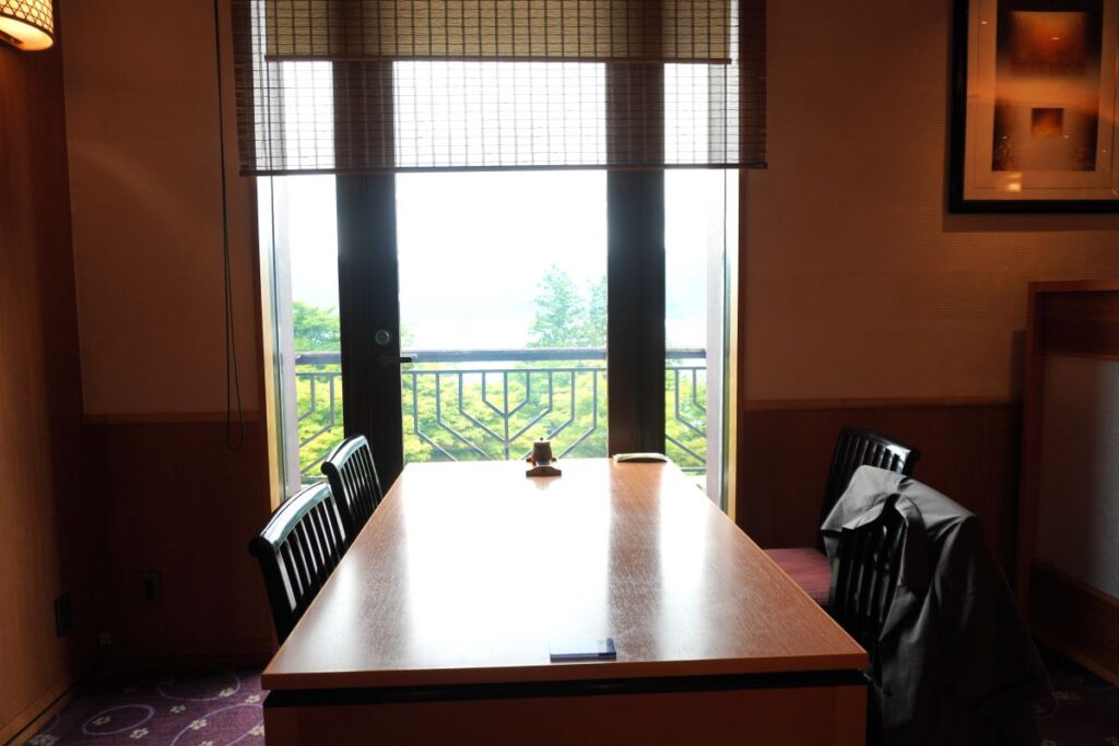 Dining at Hotel de Yama with a lake view