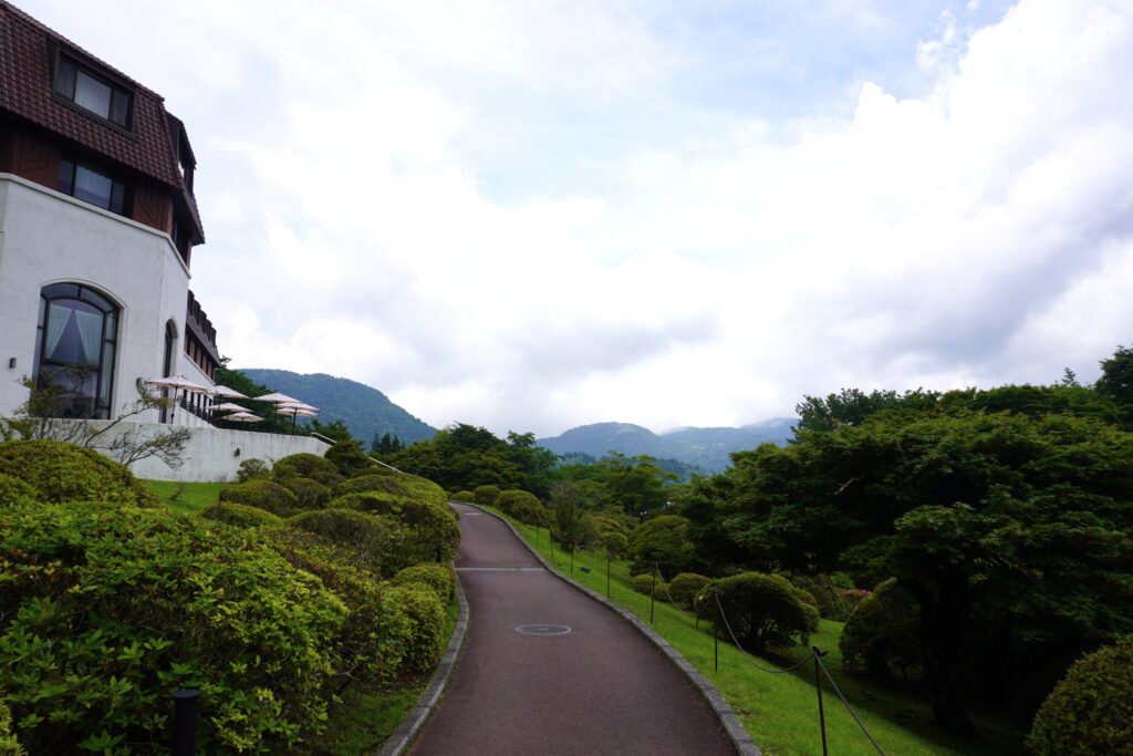Garden pathway at Hotel de Yama with views of the Hakone mountains