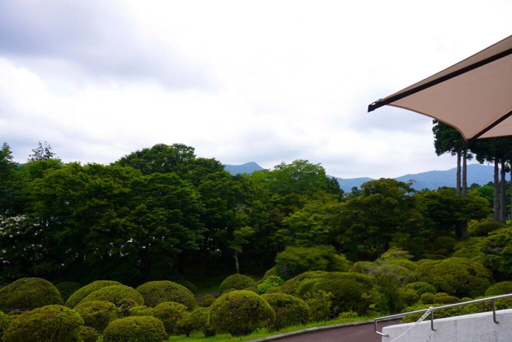 View of the gardens and surrounding mountains from Hotel de Yama in Moto-Hakone