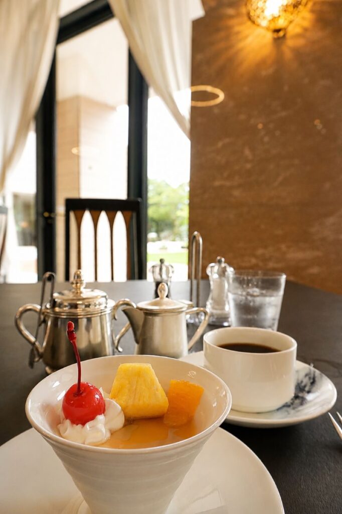 Dessert and coffee served at Hakone Hotel's lakeside restaurant overlooking the garden